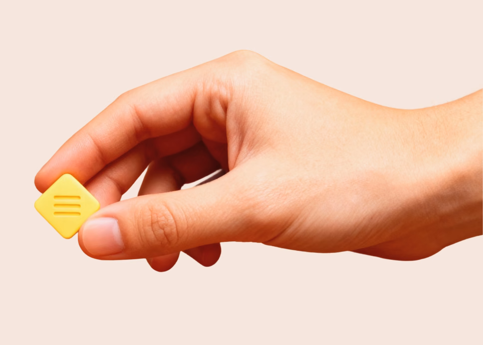 A hand holding a piece of AV Marathon Gum